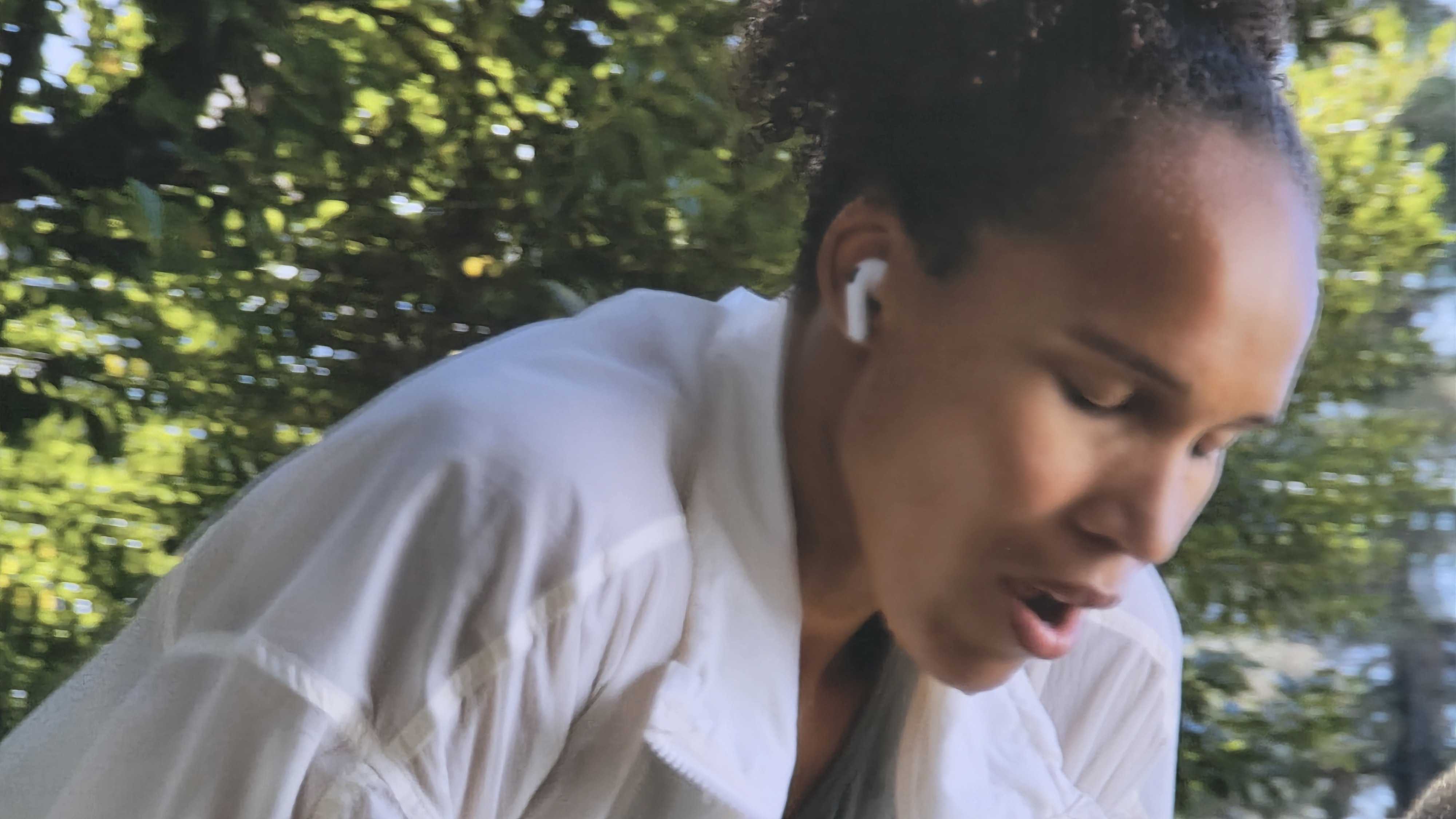 Apple Workout Buddy slide from WWDC showing an athlete who is tired of listening to Apple Intelligence