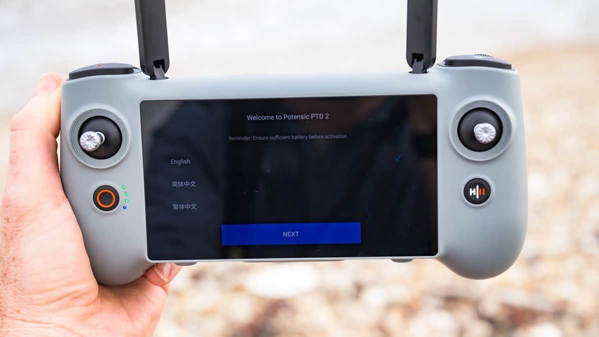 Potensic Atom 3 beginner drone's touchscreen controller in user's hand