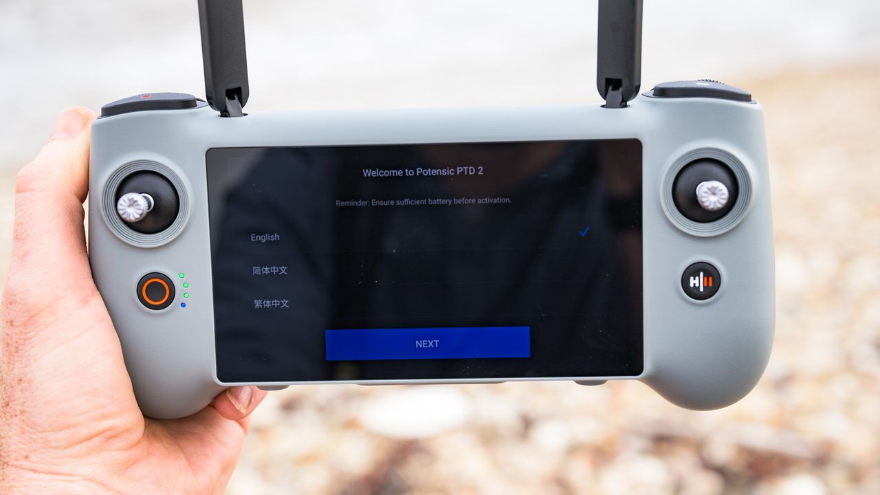 Potensic Atom 3 beginner drone's touchscreen controller in user's hand