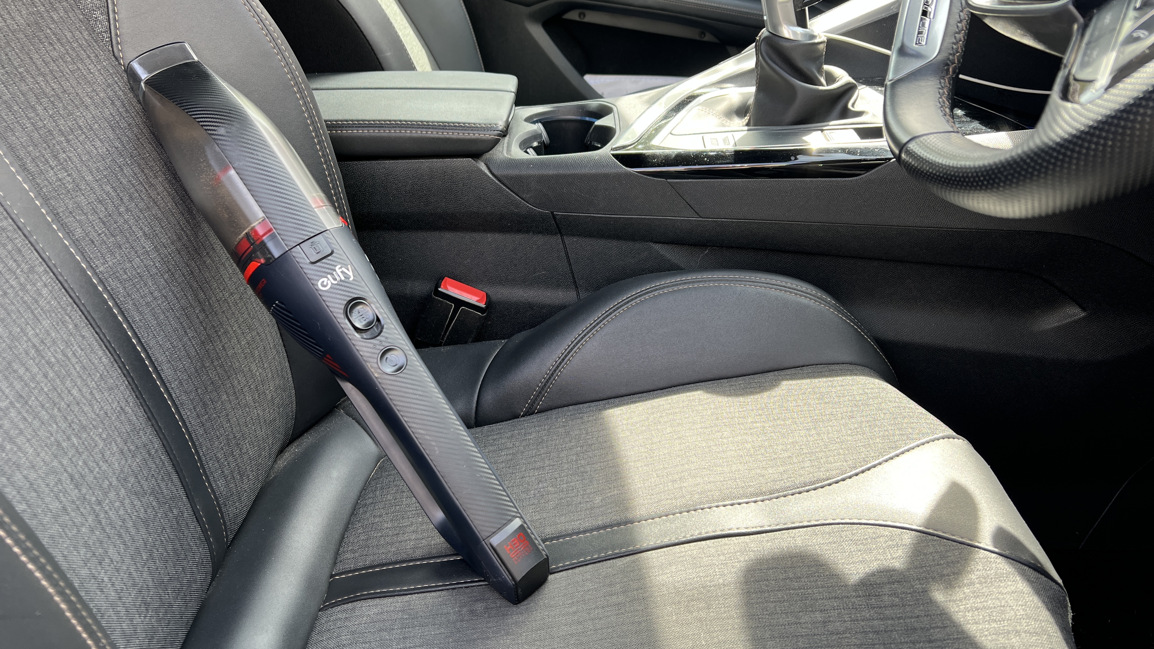 Eufy HomeVac H30 Venture on a car seat