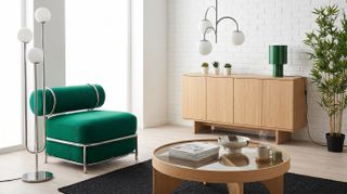 Collection of oak wood, green, and chrome IKEA furniture and homewares in a living room