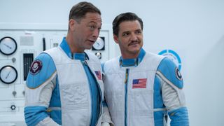 Ben Grimm talking to a smiling Reed Richards while wearing their spacesuits in The Fantastic Four: First Steps