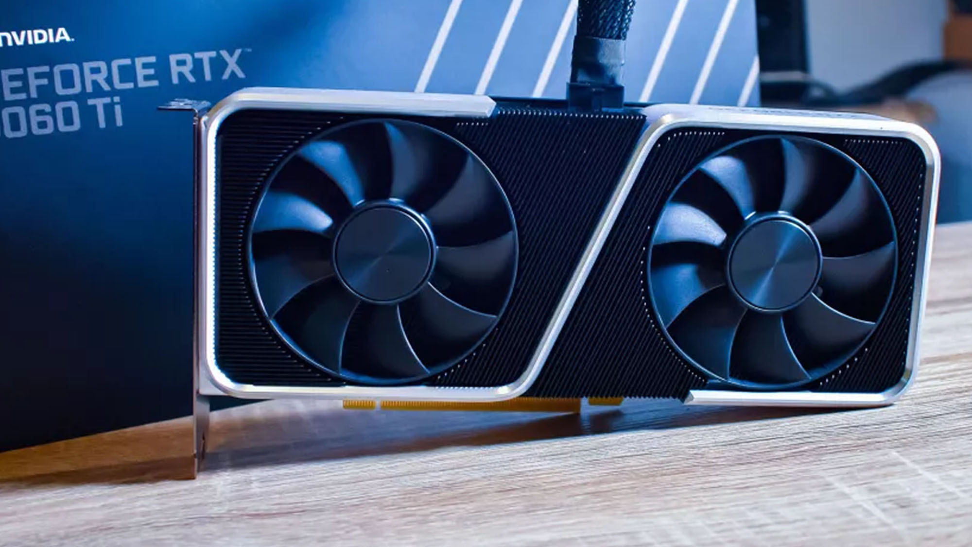 An RTX 3060 Ti against its retail packaging