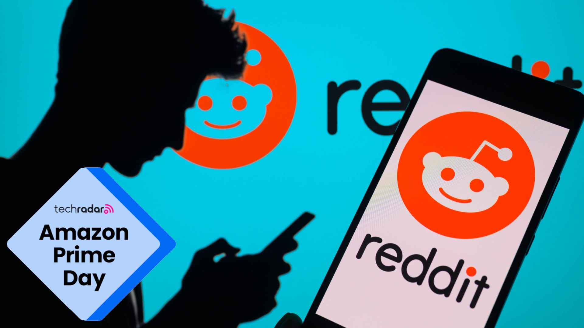 The Reddit logo is being displayed on a smartphone with the Reddit logo also visible in the background 