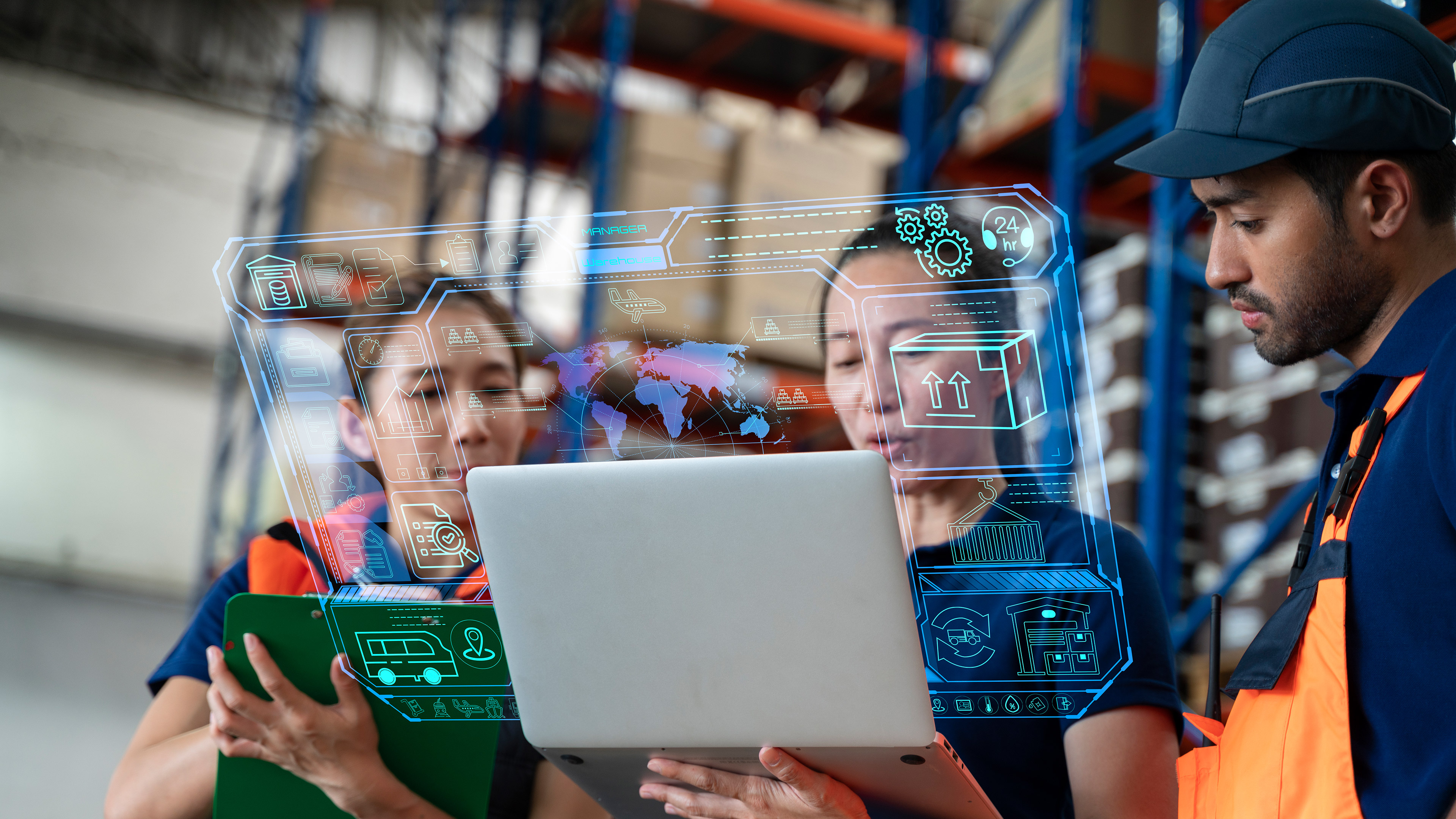 Three warehouse workers looking at a laptop. Digital symbols are superimposed on top of the scene