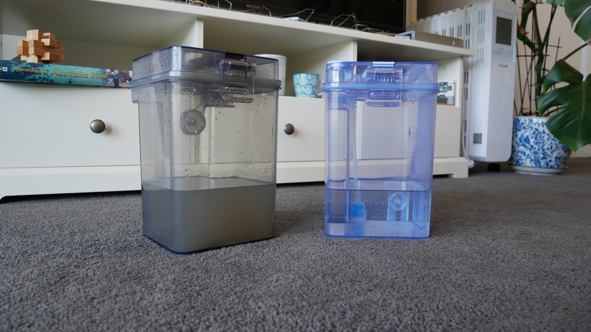 One dirty water tank and one clean water tank showing waste water after Ecovacs Deebot X1 Turbo has mopped