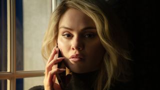 Selena Gomez as Jessi on the phone in Emilia P&eacute;rez.
