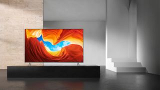 Sony XH90/X900H on a TV unit in a minimalist room.