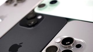 iPhone 15 family back angled closeup &ndash; darkened edit