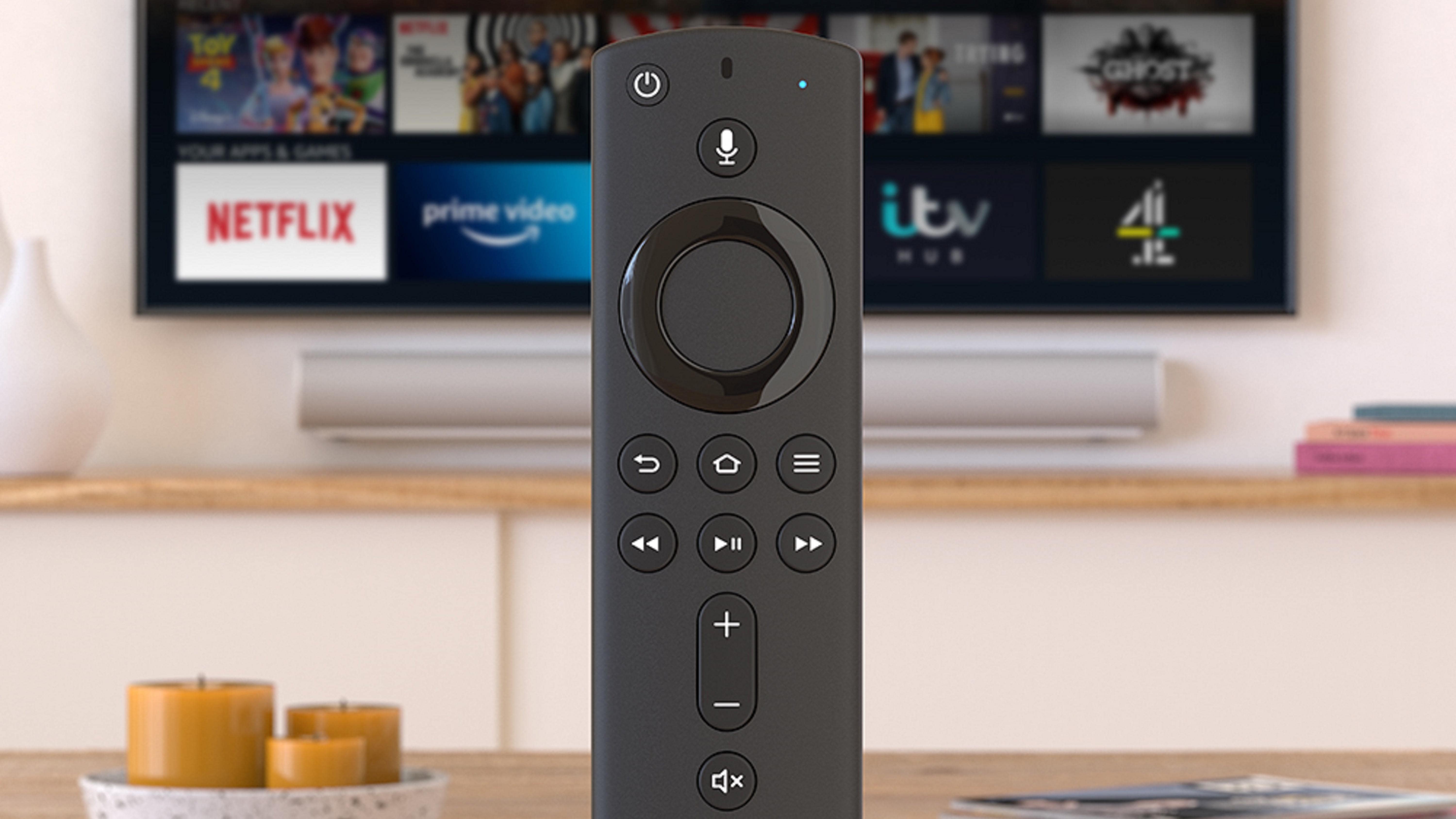 Amazon Fire TV Stick in front of a TV set showing various streaming service apps