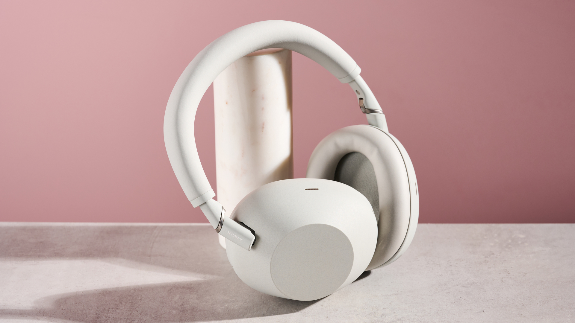 Sony WH-1000XM6 leaning on pole