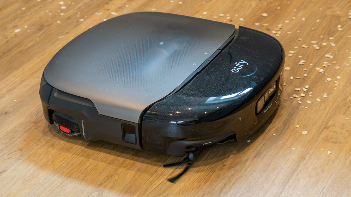 Eufy Omni S2 robot vacuum cleaning oats off hard floor