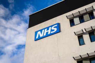 View of the NHS (National Health Service) logo at the Springfields Medical Centre in the centre of Warrington, Cheshire.