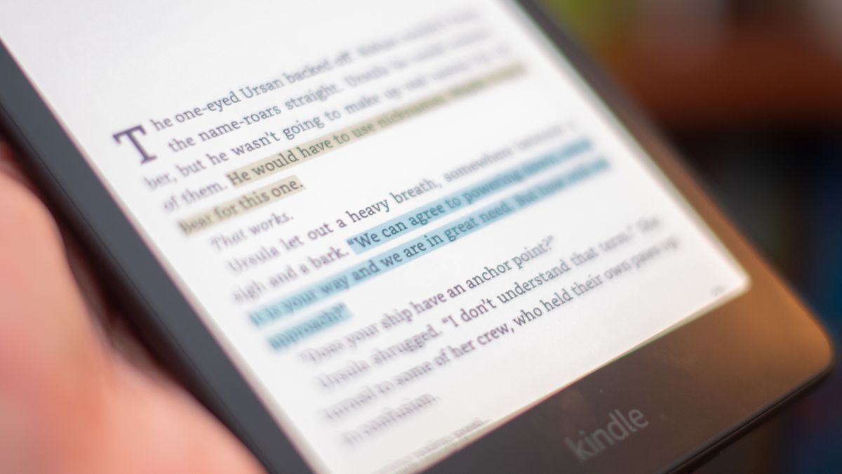 Amazon Kindle Colorsoft Signature edition e-reader showing graphic novels, cookbooks, and fiction, as well as settings