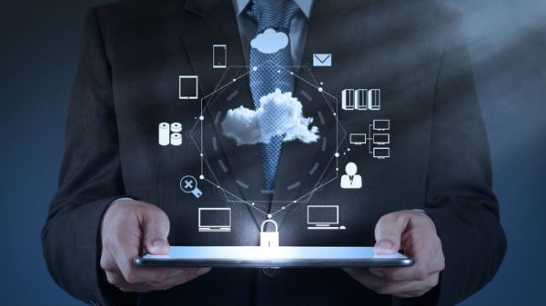 Technology icons floating above an opened laptop.
