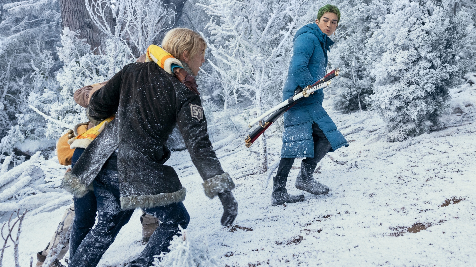 Sanji and Mackenyu walk up a snowy hill in One Piece season 2