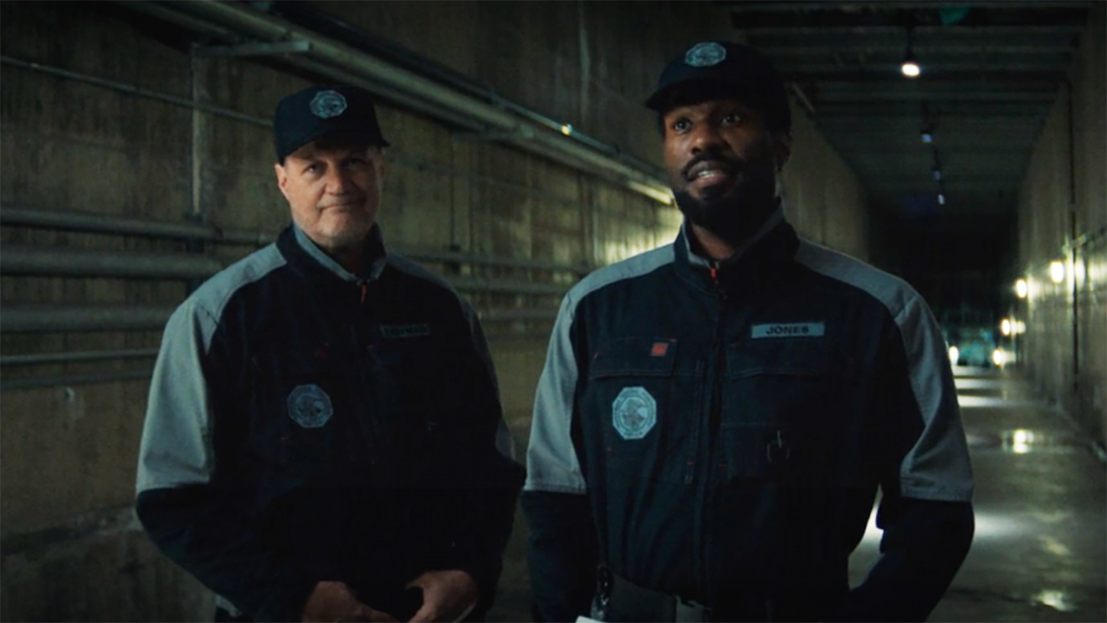 Chuck Eastman and Simon Williams wearing DoDC security uniforms in the DoDC's prison in Wonder Man episode 8