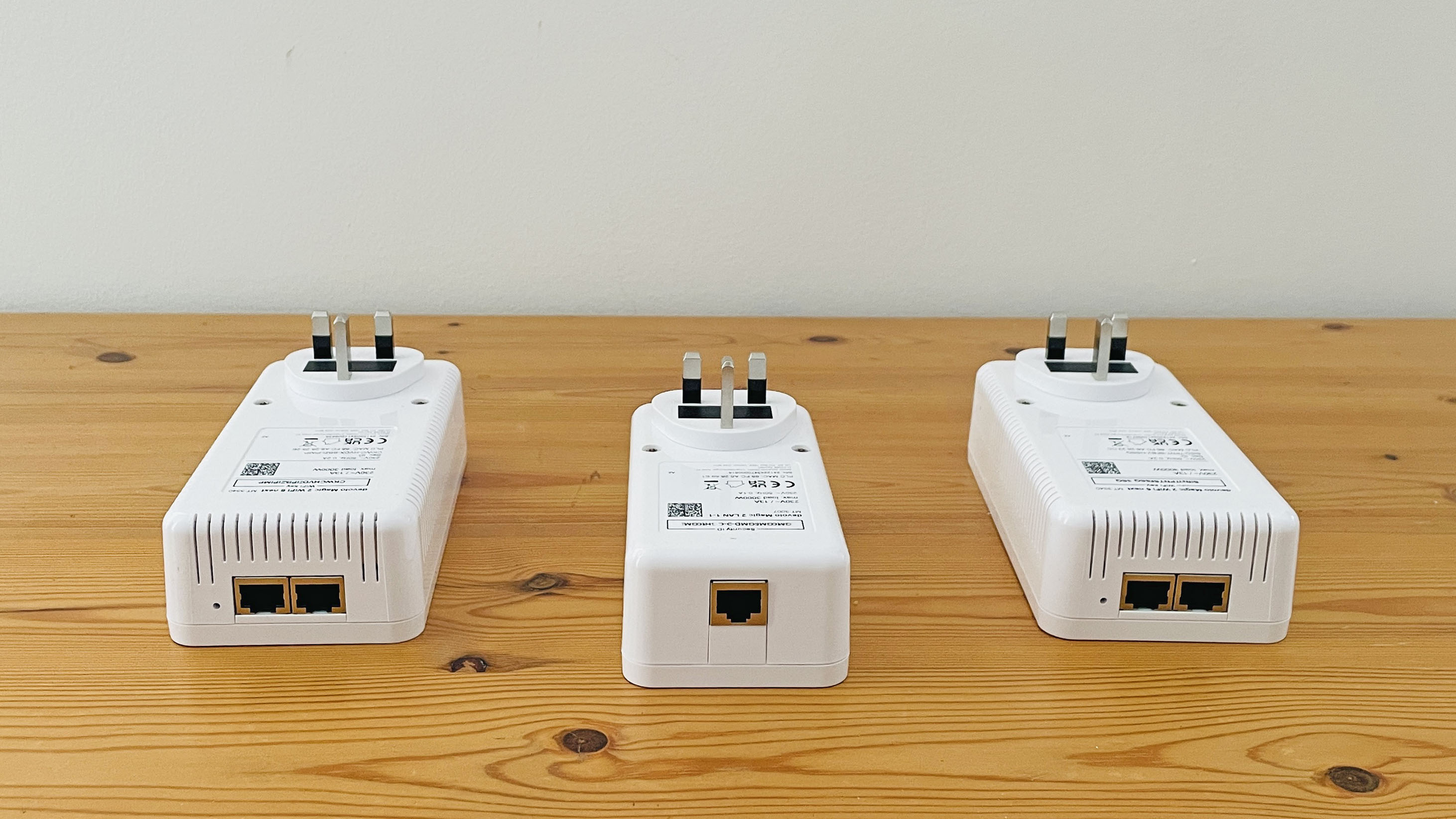 Devolo Magic 2 WiFi 6 next on wooden table