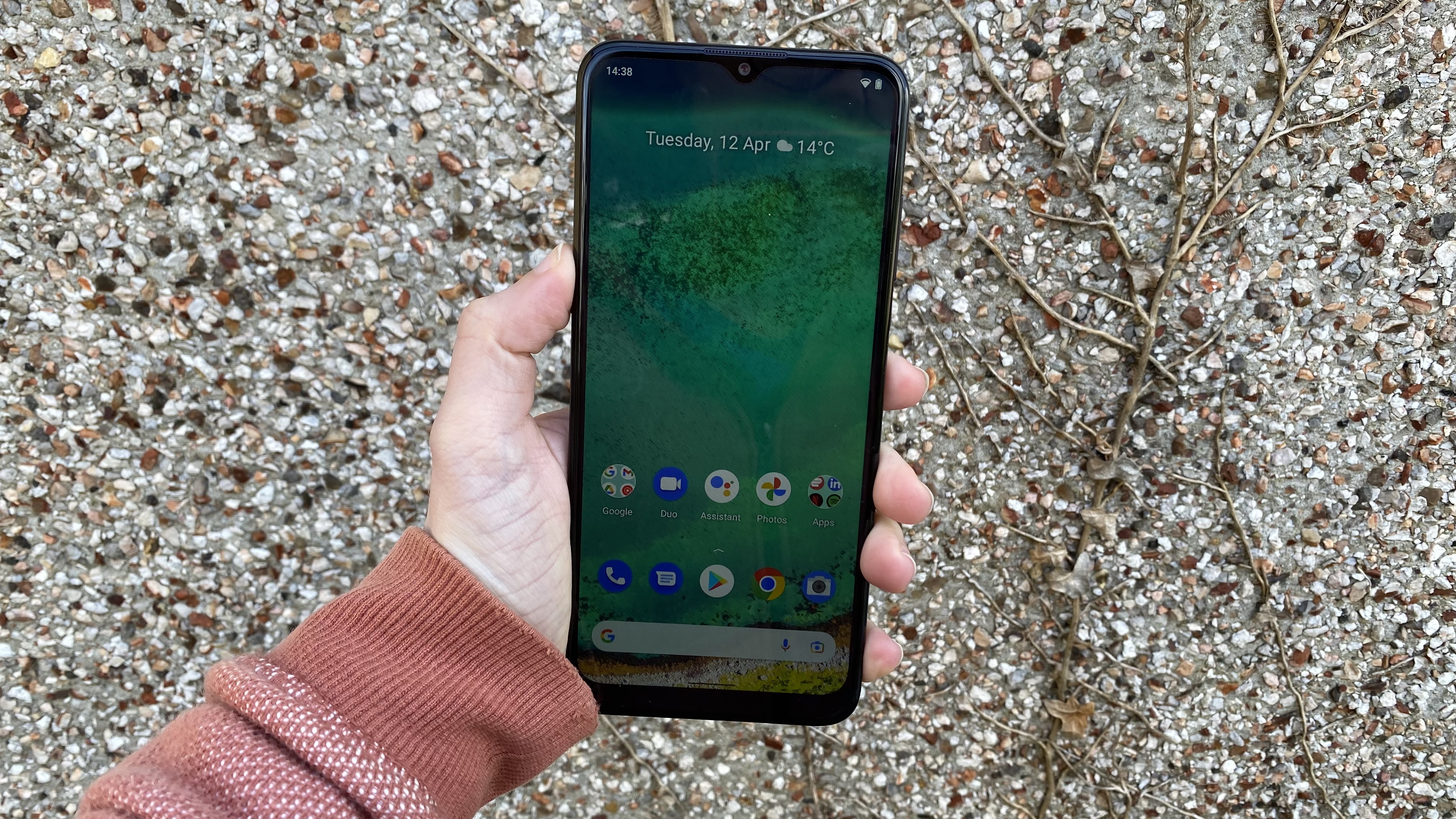The Nokia G11 with the screen on, in someone's hand