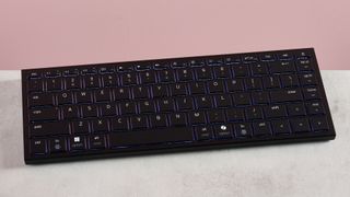 Razer Joro on desk with pink background