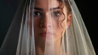 A close up of Zendaya wearing a veil in The Drama