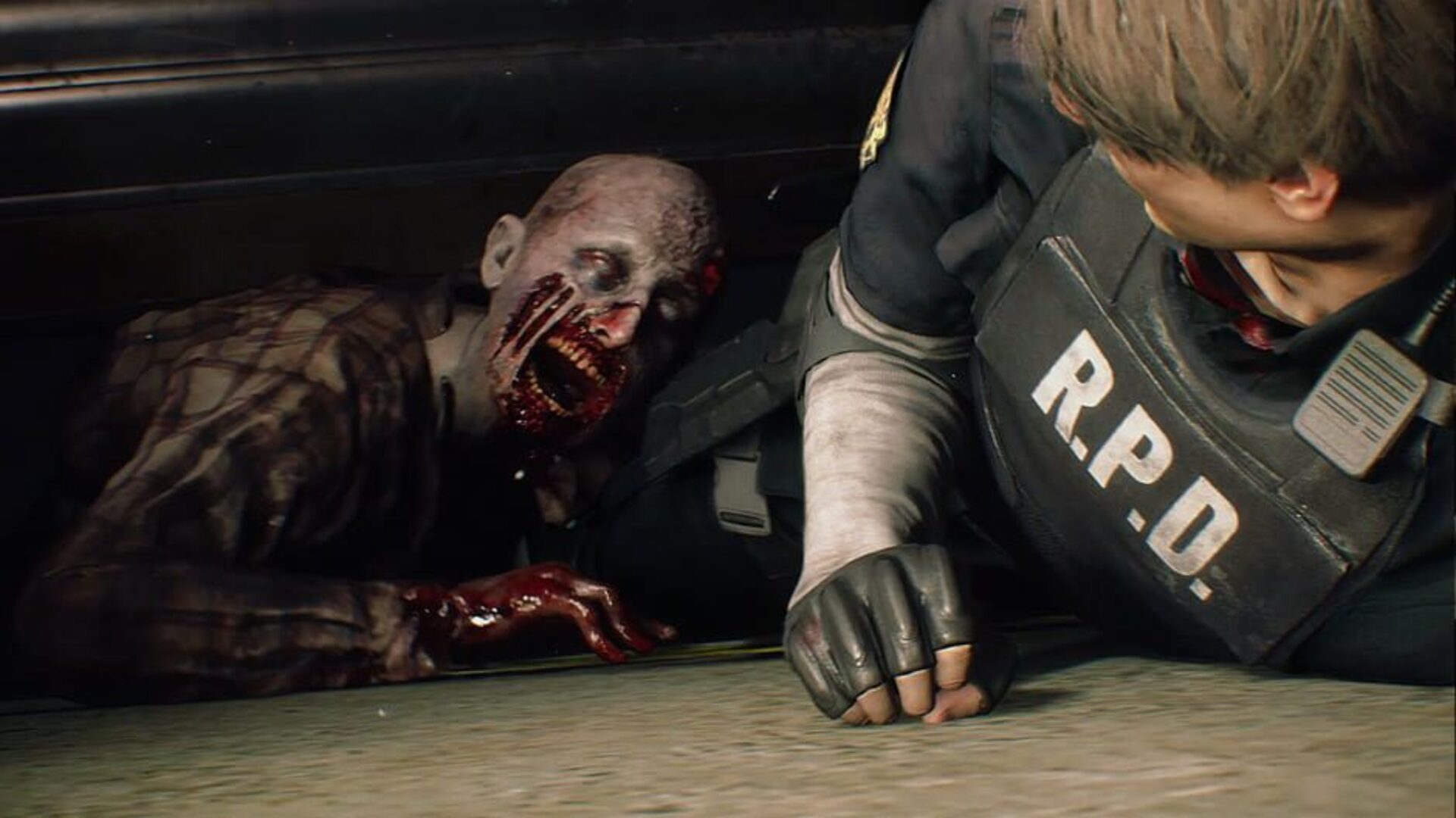 Leon escapes a zombie's grasp