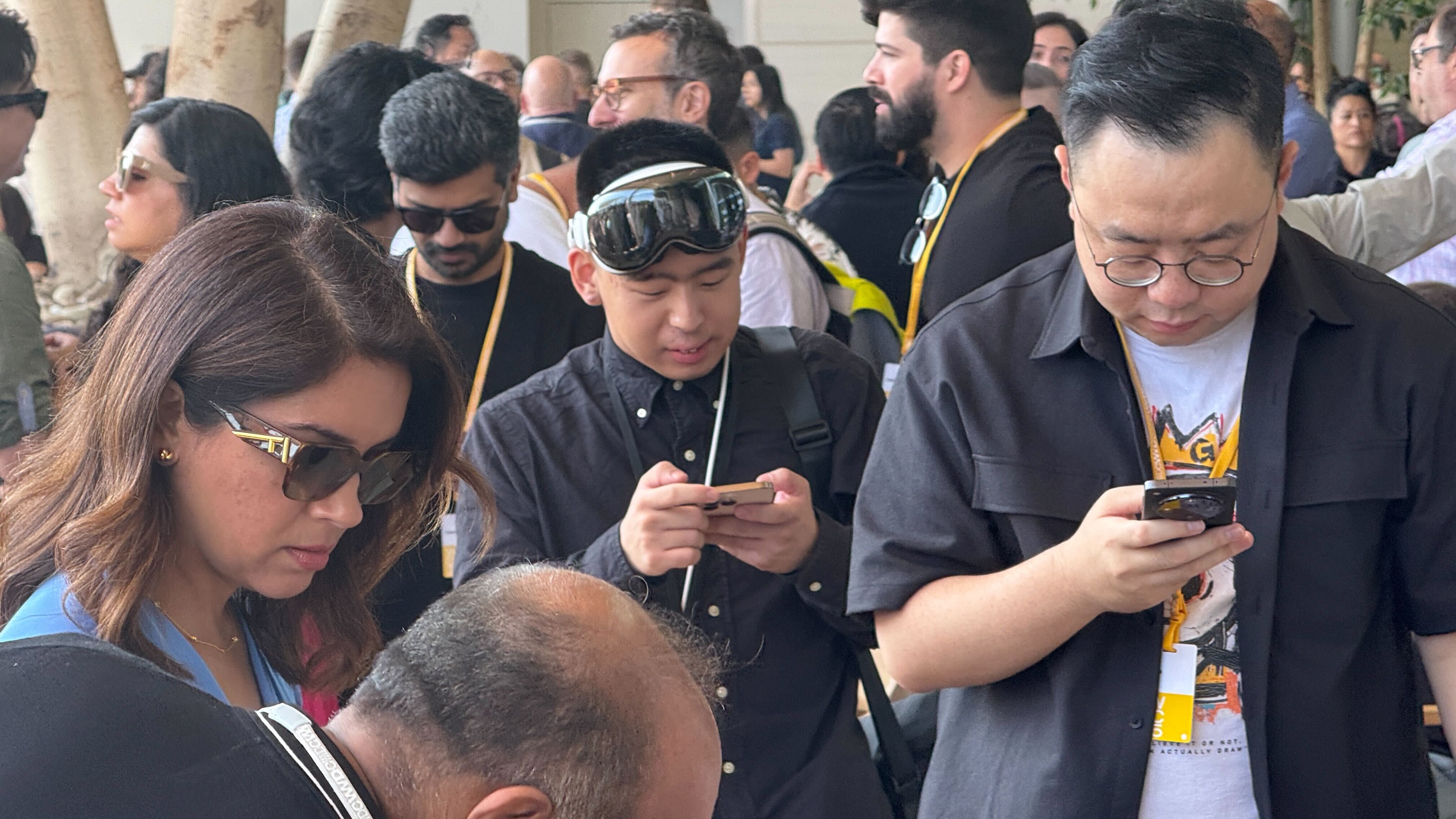 People at Apple Campus wearing Apple Vision Pro