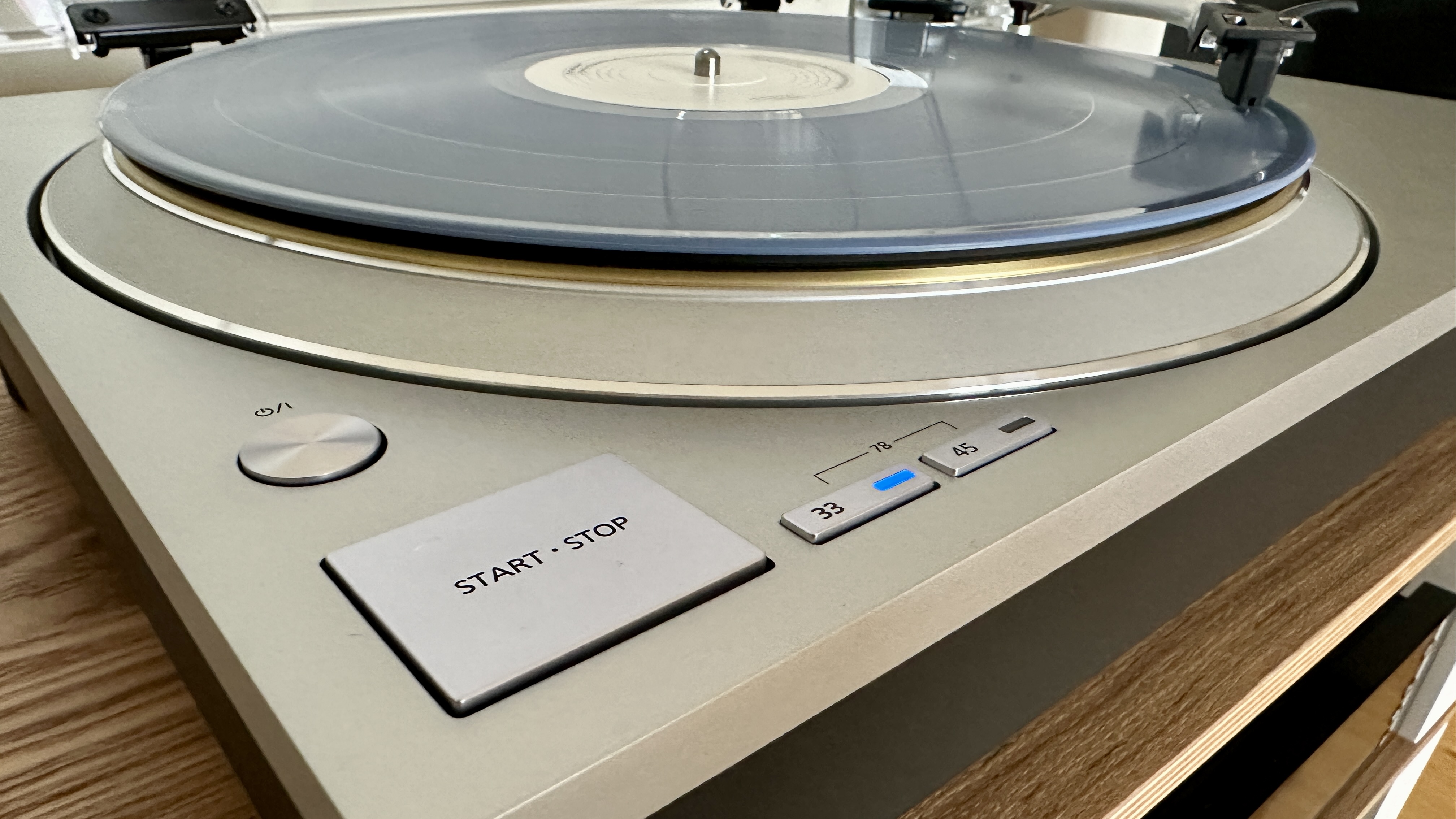 Technics SL-1300G turntable buttons showing 'start/stop' and and '33' and '45' functionality.