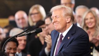 US President Donald Trump reacts before delivering his inaugural address after being sworn in inside the Rotunda of the US Capitol in Washington, DC, on January 20, 2025. 