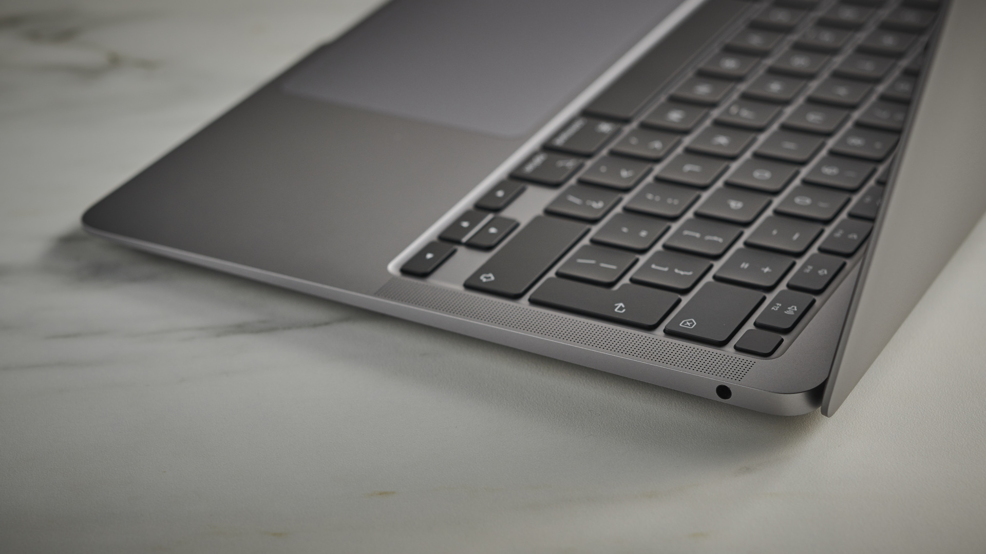 Apple MacBook Air (M1,2020) on a gray surface