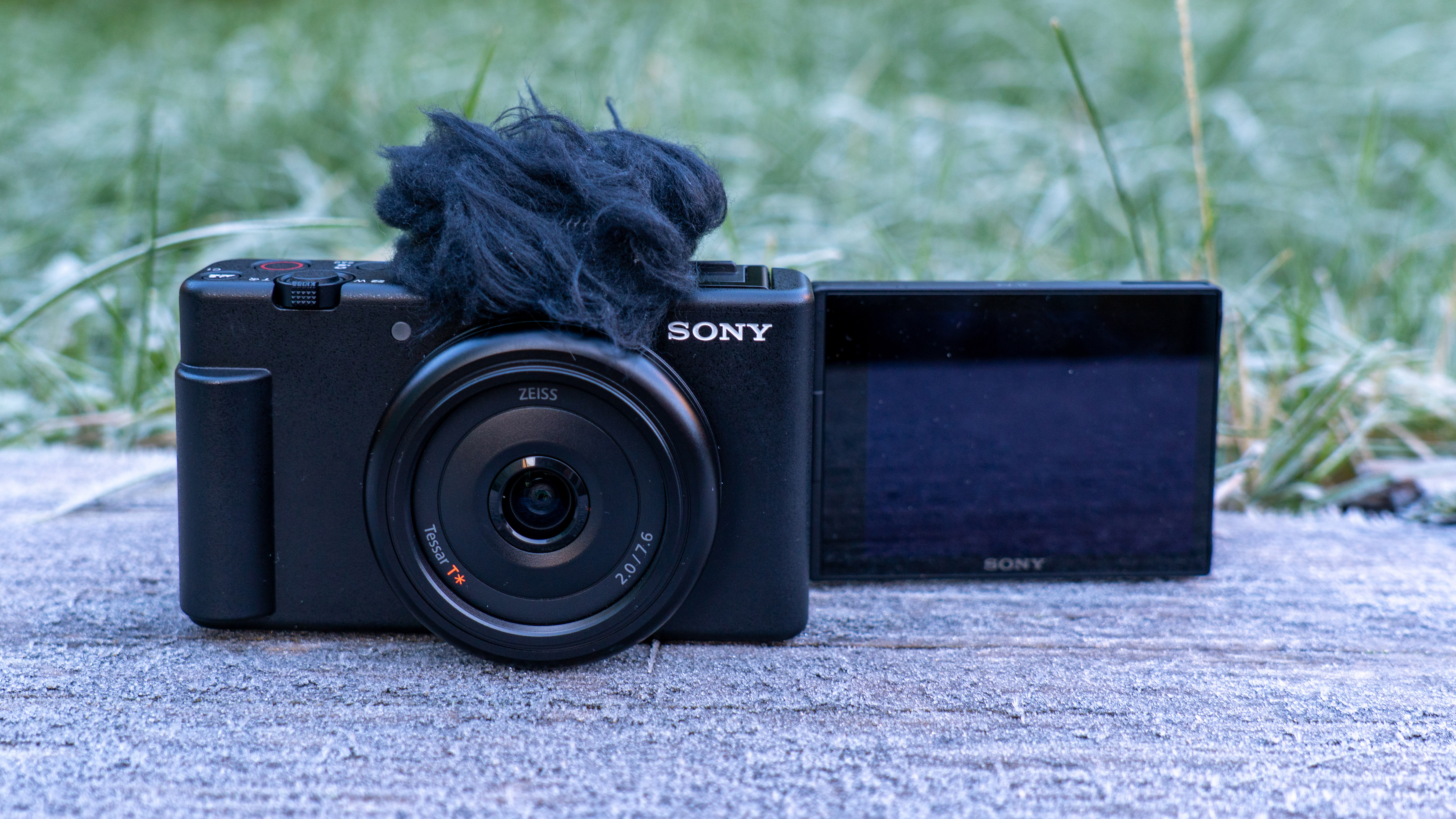 Sony ZV-F1 with flip out screen out placed on a bench