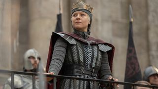 Rhaenyra standing as she holds onto a guardrail in House of the Dragon season 3 episode 8