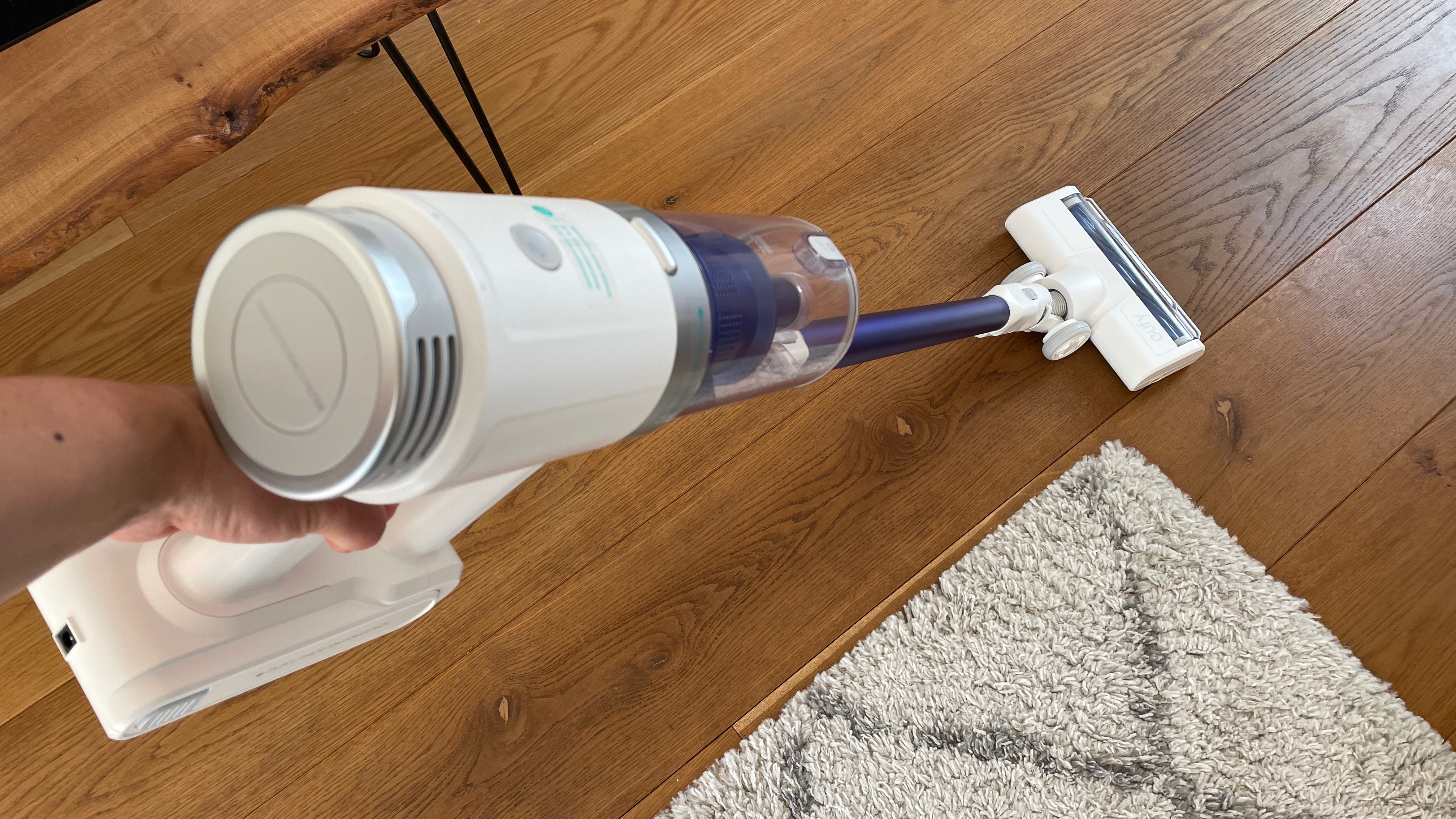 Eufy HomeVac S11 Infinity being used on hard wood skirting