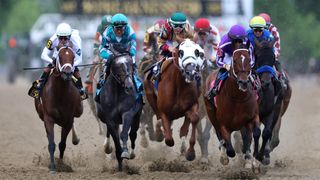The field heads into the first turn during the 150th Preakness Stakes the 150th Preakness Stakes at Pimlico Race Course