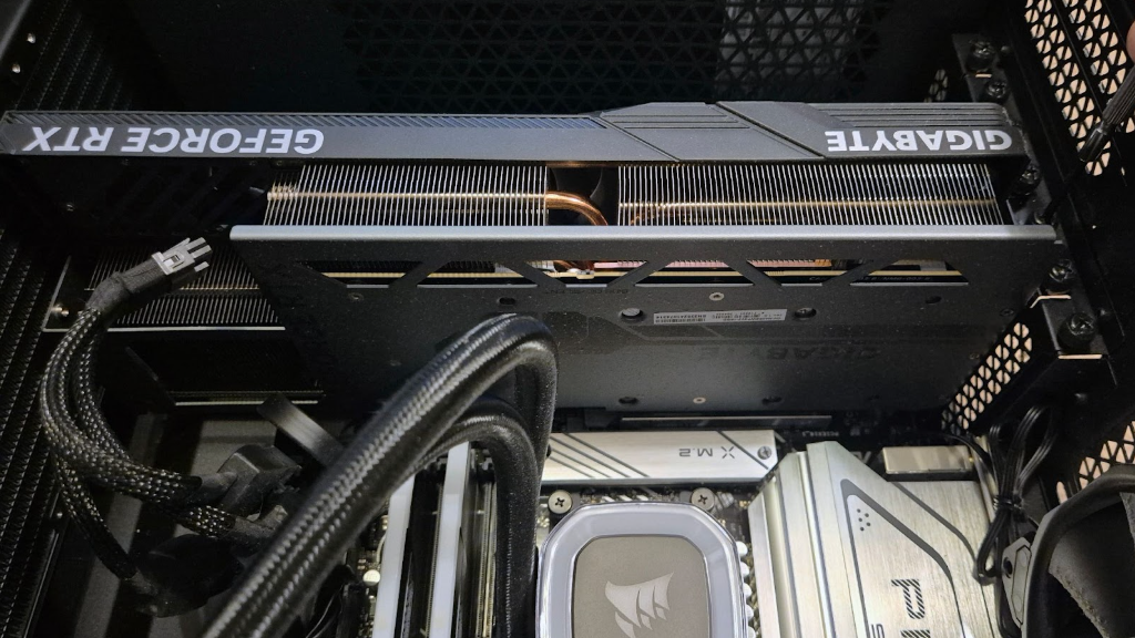 A graphics card in a PC case with its power cables disconnected