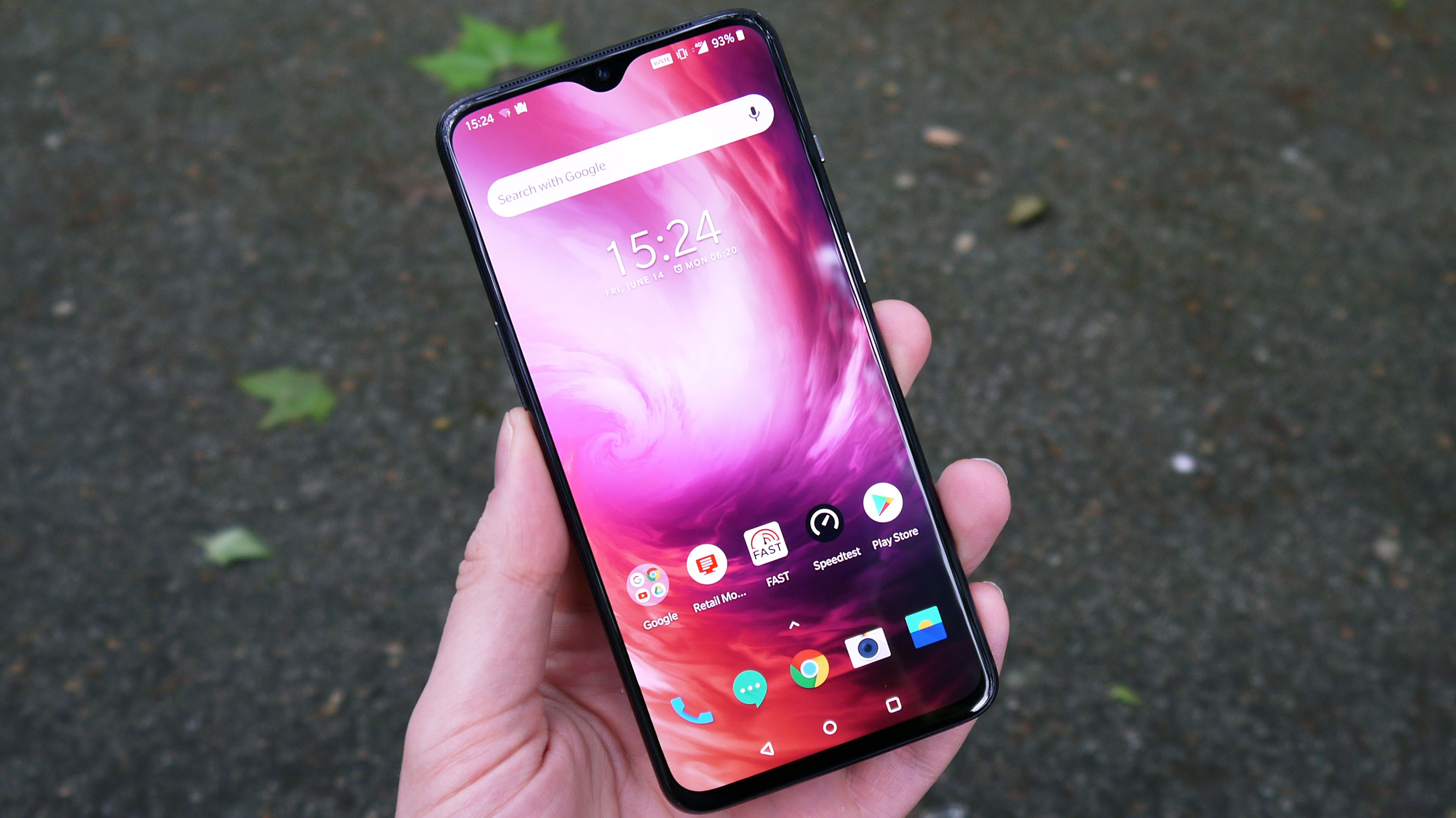 The OnePlus 7 held in the hand