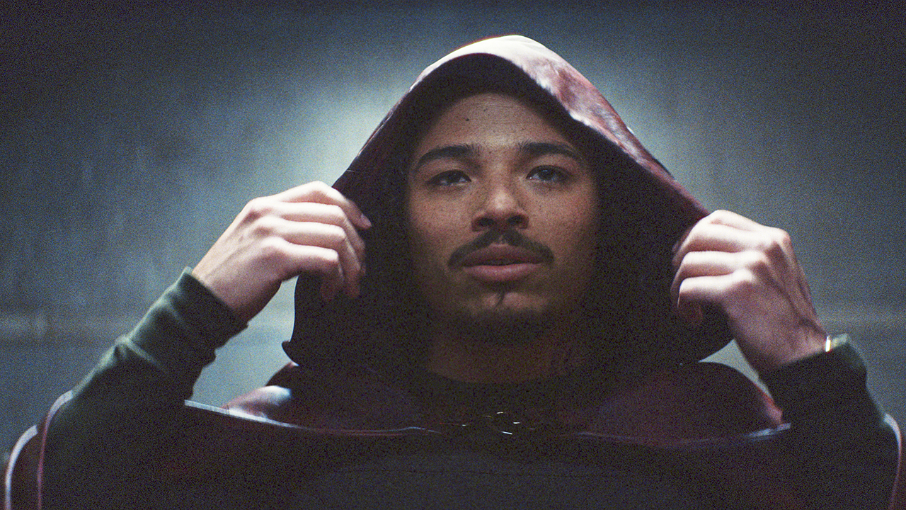 Anthony Ramos' Parker Robbins/The Hood with his hood up in Marvel's Ironheart TV show