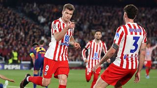 Alexander Sorloth of Atletico Madrid celebrates with Matteo Ruggeri during the UEFA Champions League match against Barcelona.