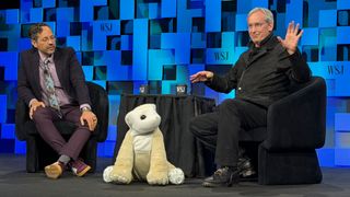 WSJ's Chris Mims on left, Daphne, the Familiar robot middle, and Familiar Machines & Magic CEO Colin Angle at the Wall Street Journal Future of Everything conference on May 4.