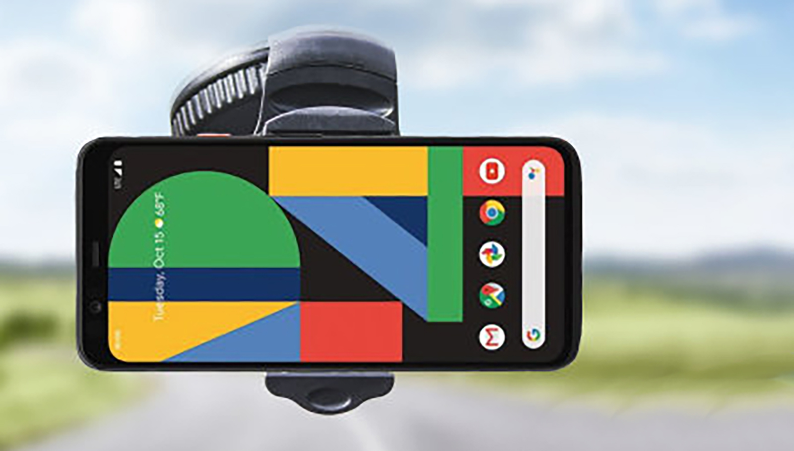 A Google Pixel phone mounted on a car windshield