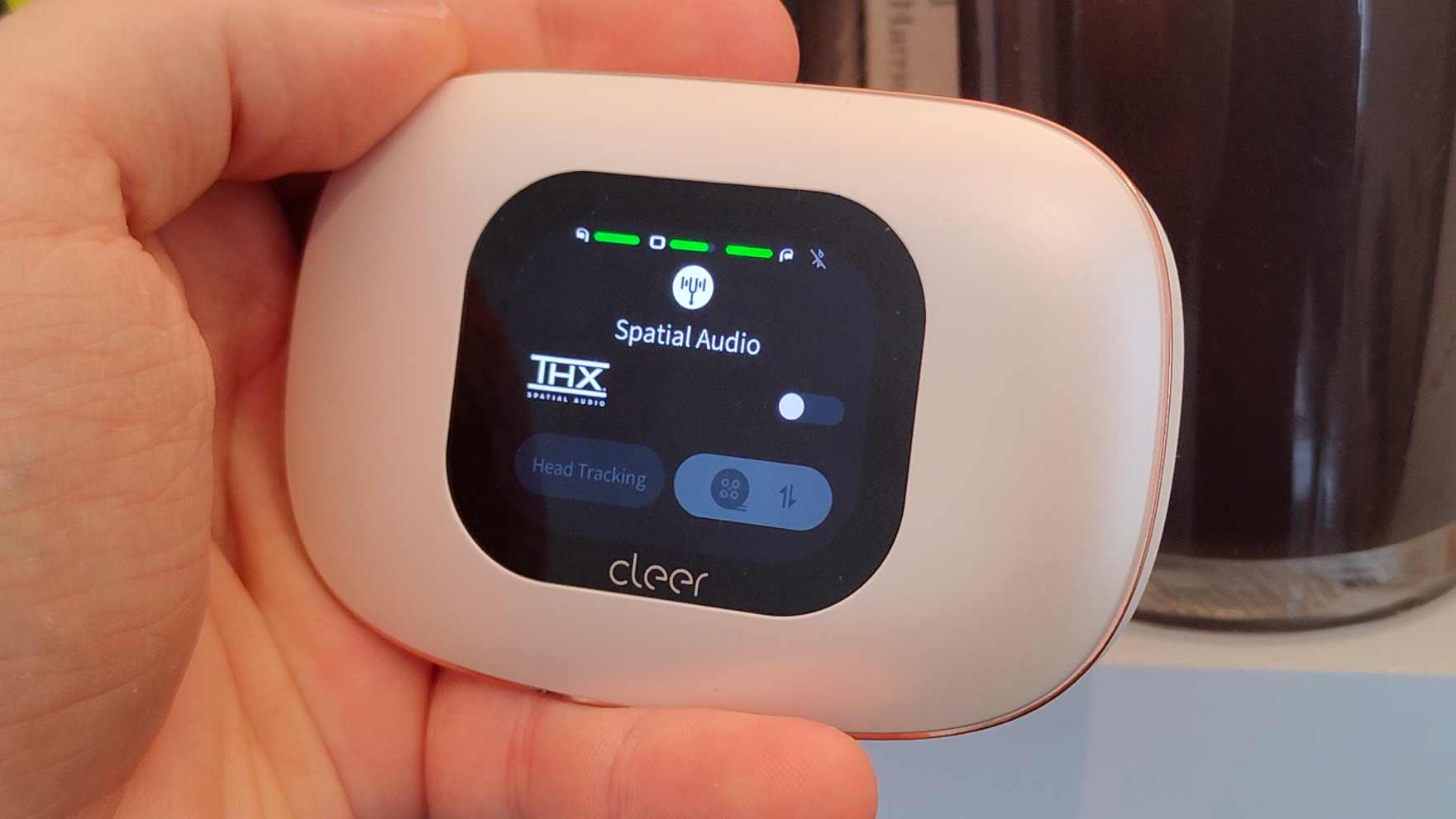 The Cleer Arc 5 case, showing its Spatial Audio toggle.