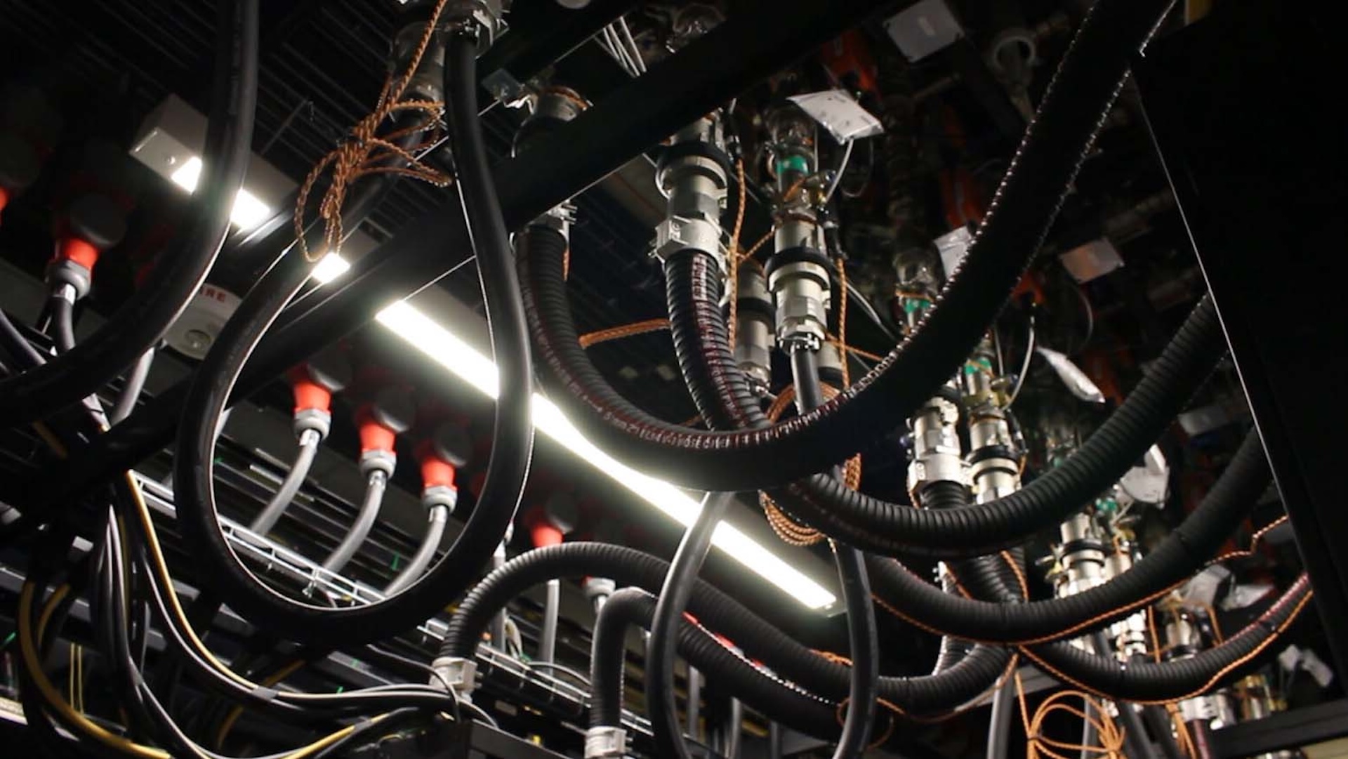 Liquid cooling infrastructure overhead pipes routes into powerful AI servers