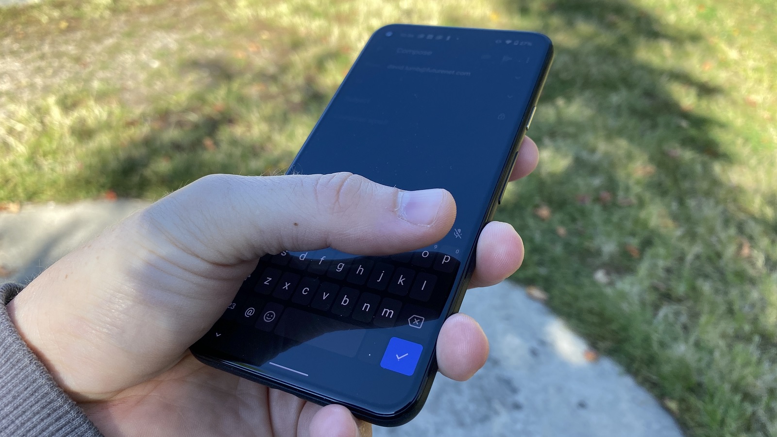 A Google Pixel 5 from the front, in someone's hand