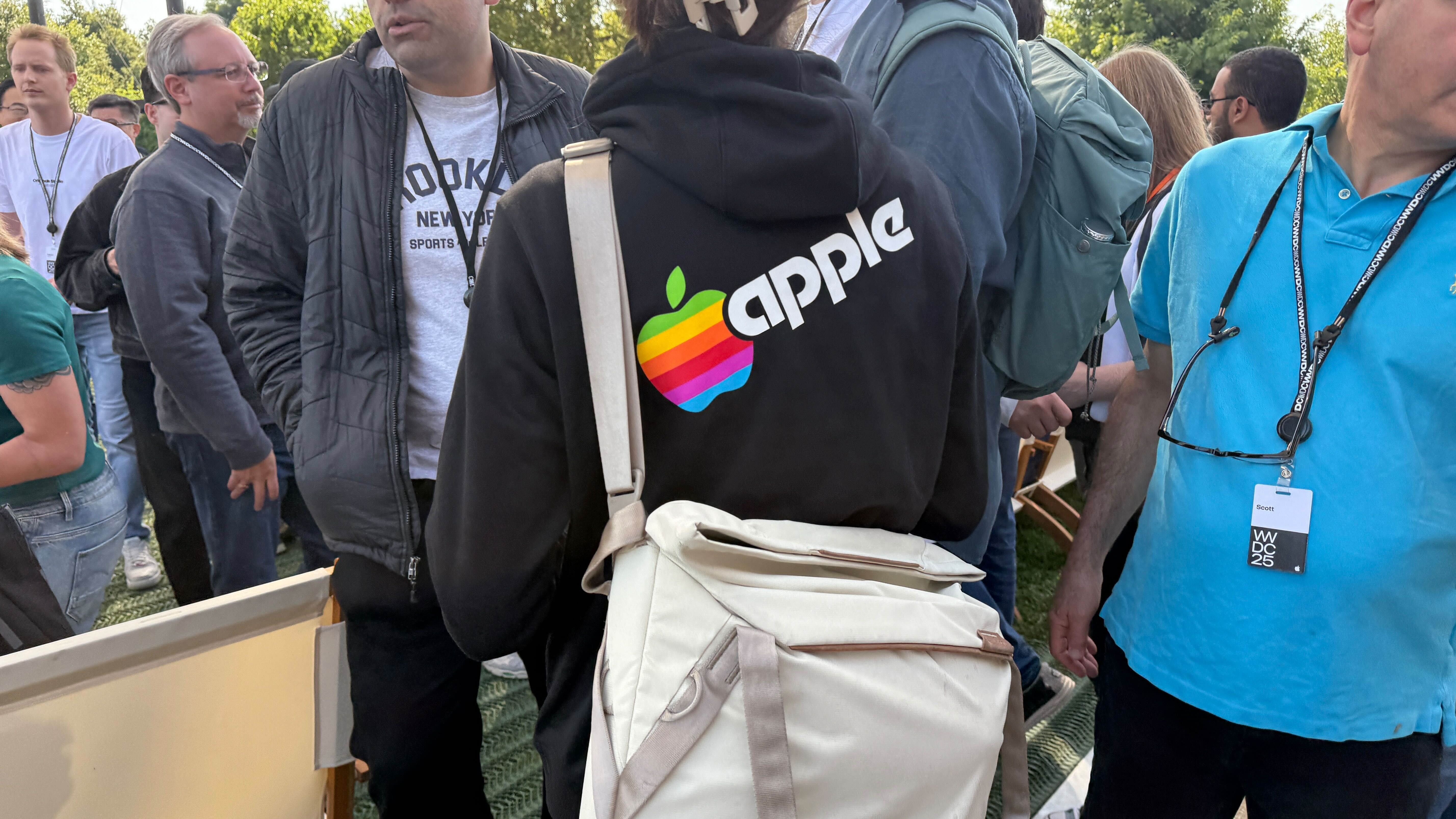 Images from around Apple Campus during WWDC 2025 including rainbow logos and graphics for Pride