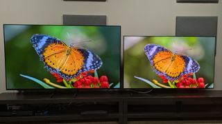 Samsung S85F (left) vs Samsung S95F (right) displaying orange butterfly on screen 
