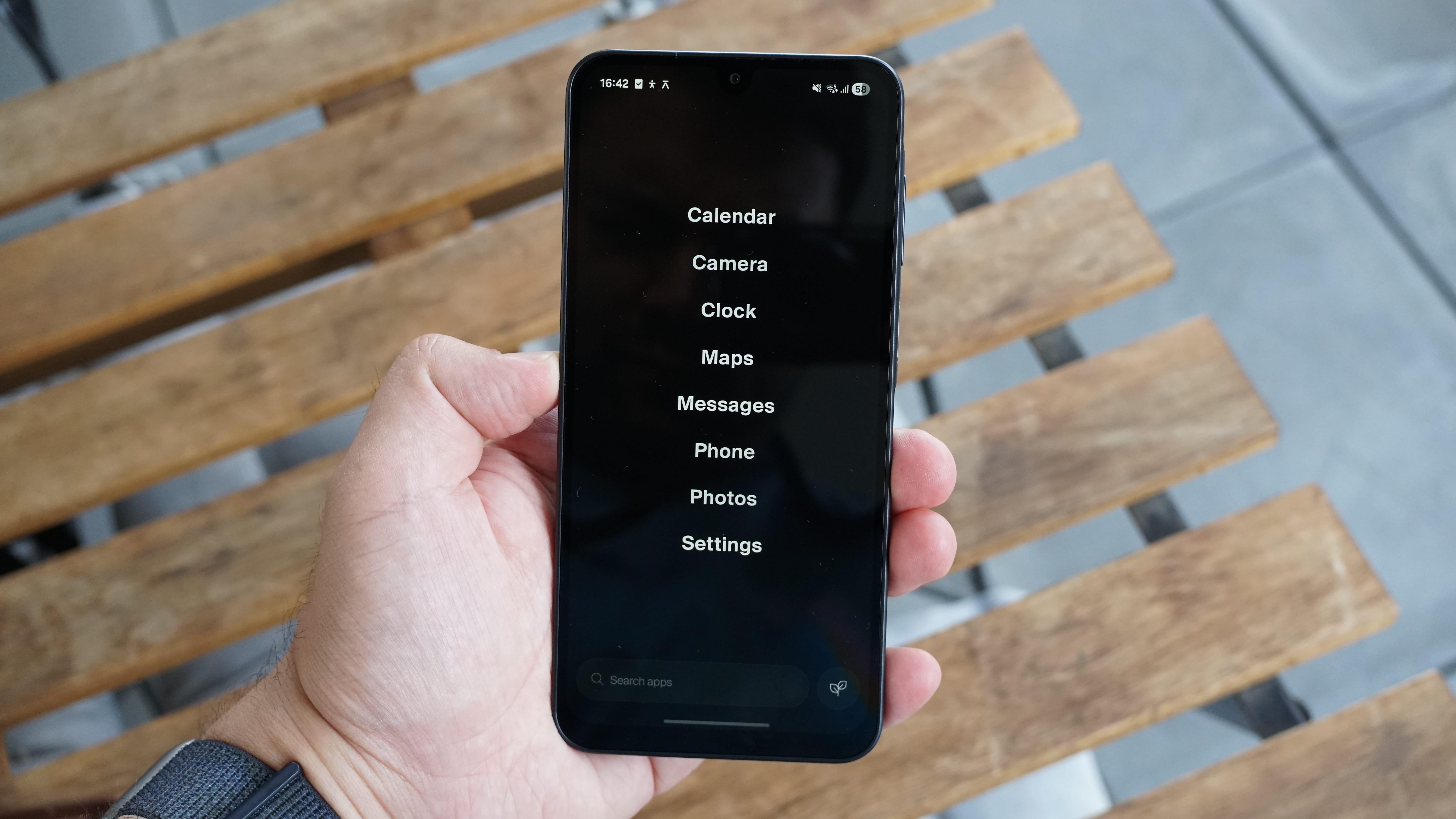 The Balance Phone being held in the hand
