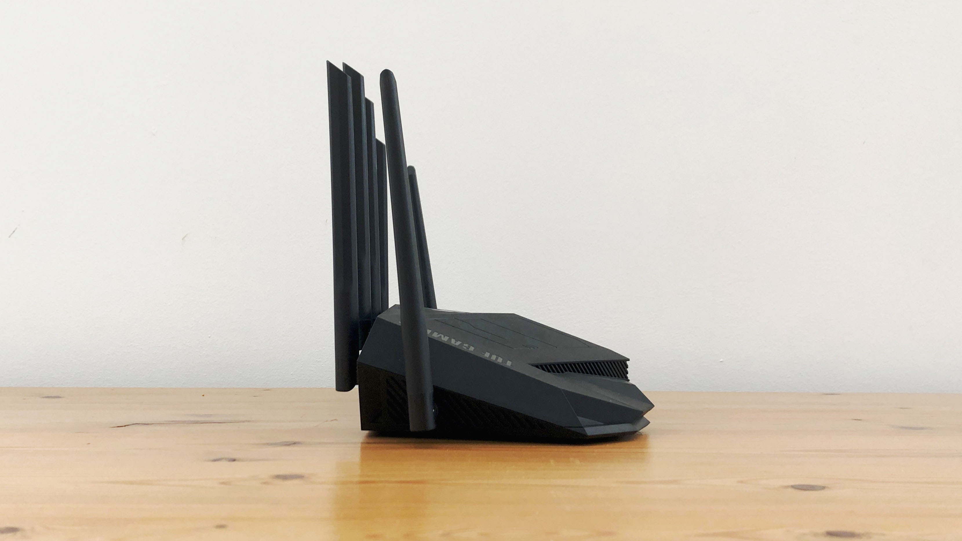 Asus TUF Gaming AX5400 on a wooden desk