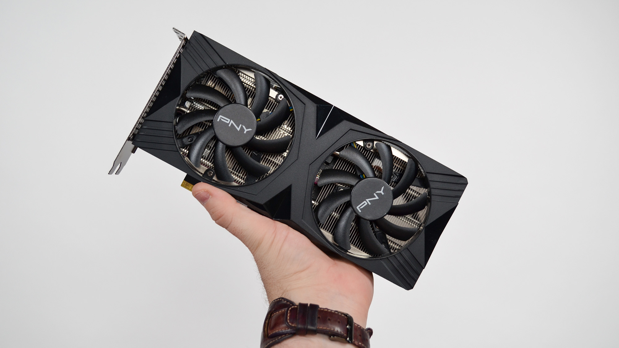 A PNY GeForce RTX 4060 Ti on a desk with a pink desk mat.