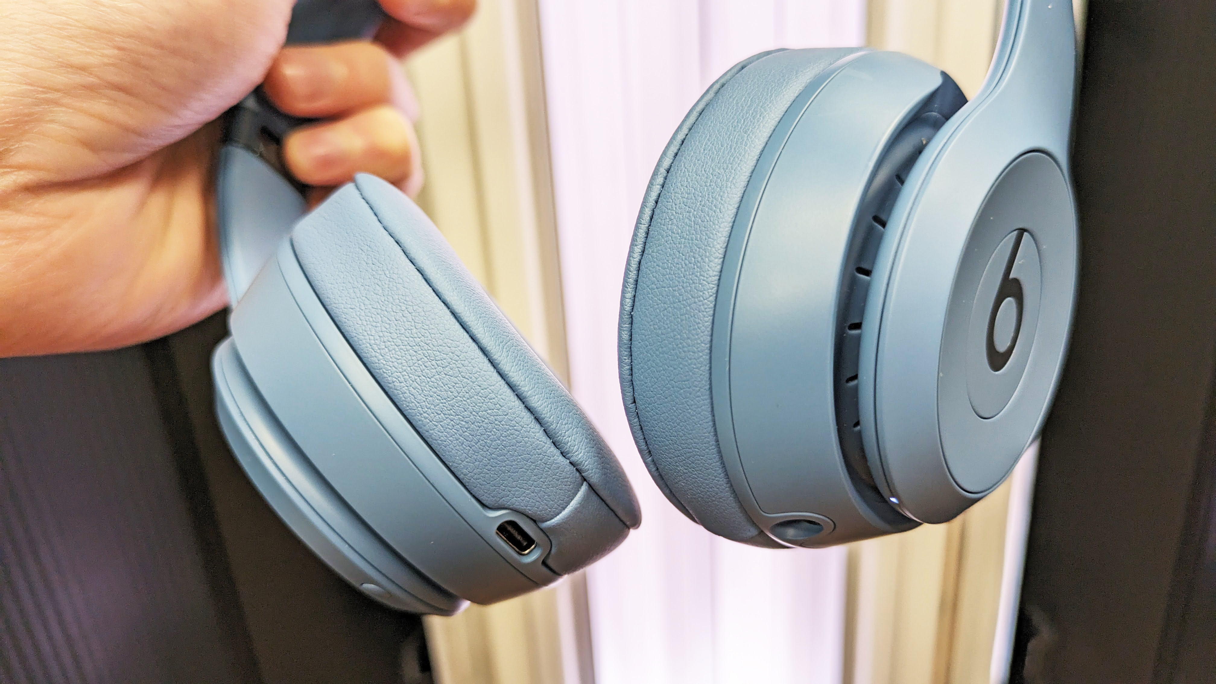 Beats Solo 4 held in hand