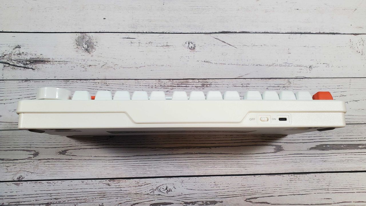 white and orange mechanical keyboard